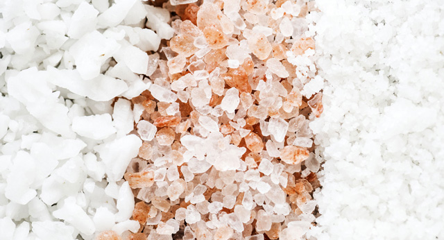 Closeup image of unrefined, unprocessed sea salt. A better option than table salt.