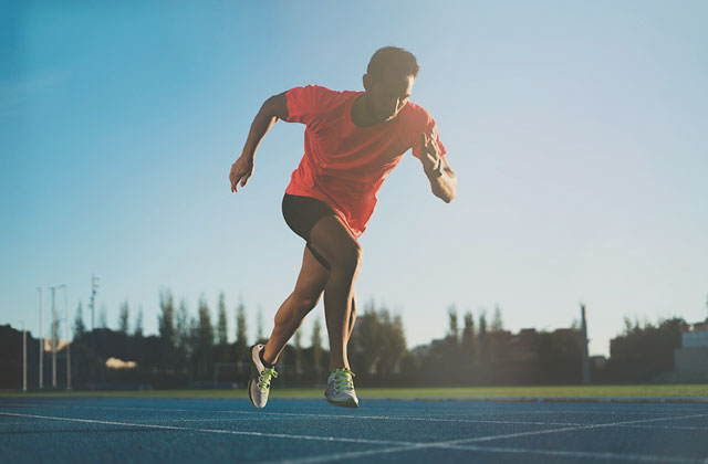 Male athlete running on track. Iron liquid mineral for energy.