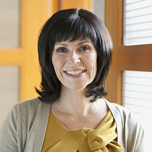 Dark-haired woman smiling 