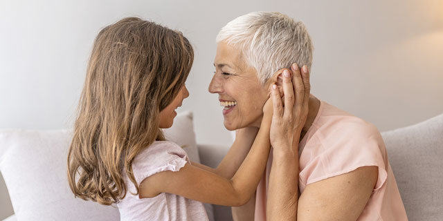 Woman embracing young grand-daughter. There is growing research to suggest that selenium can help with anti-ageing.