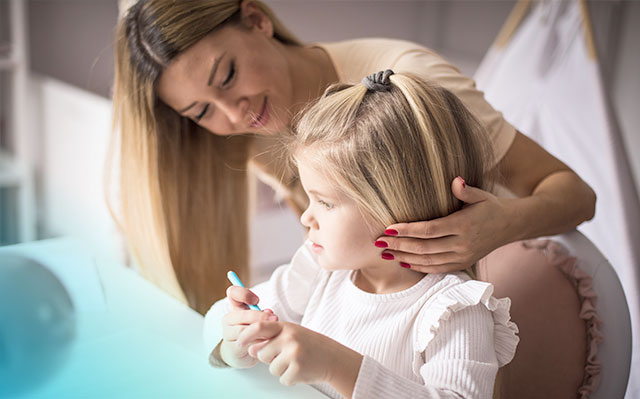 Woman taking care of her daughter with minerals supplements